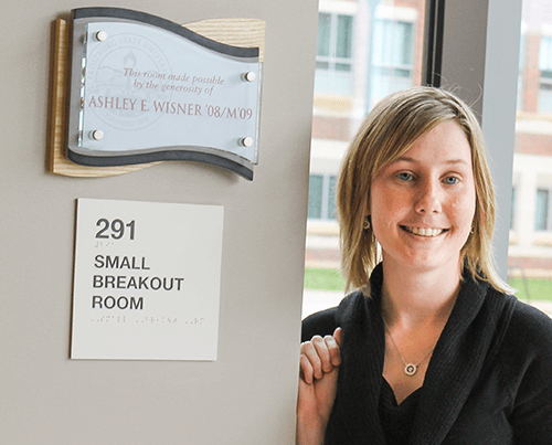 Ashley Wisner and her plaque in the CCIT