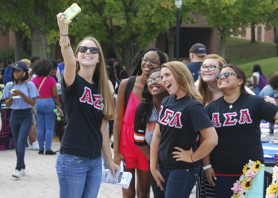 female students take selfie together