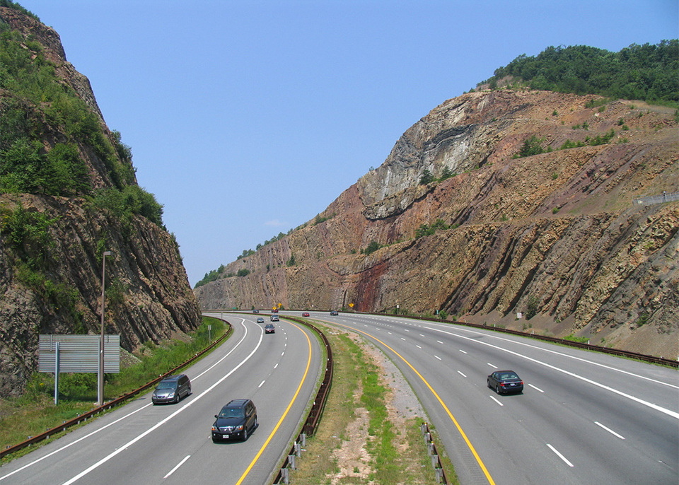rural interstate cuts through hillside at sideling hill