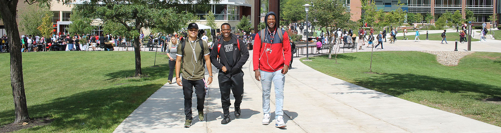 Three smiling students  