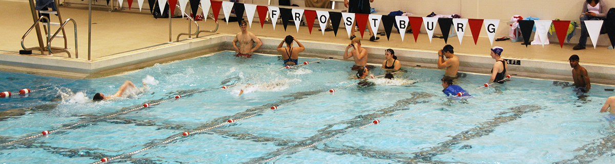 swimmers getting ready fo race in the pool