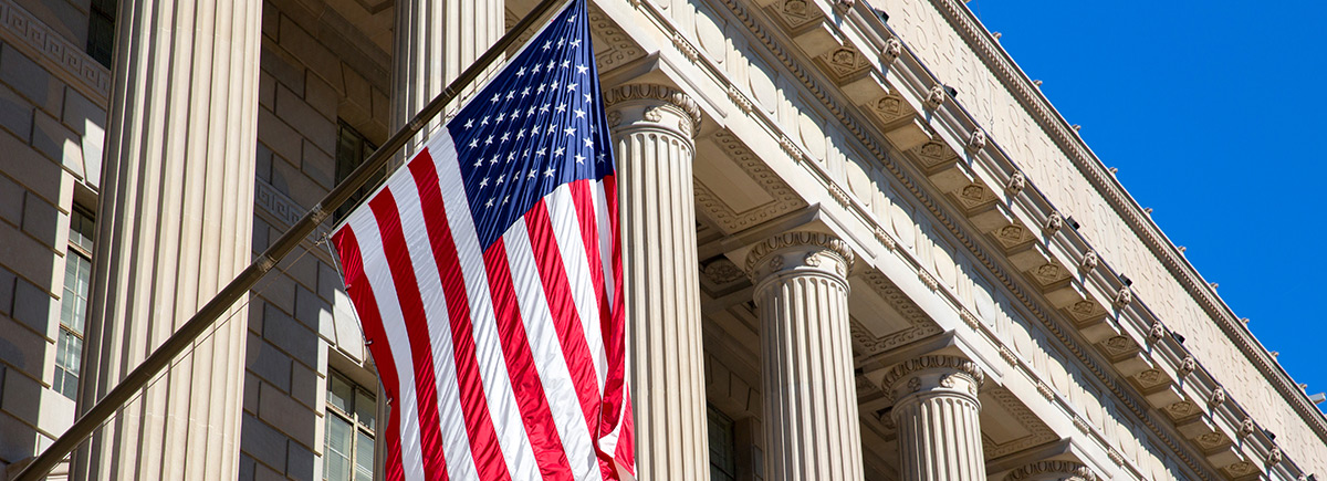 US flag in front of a federal building 