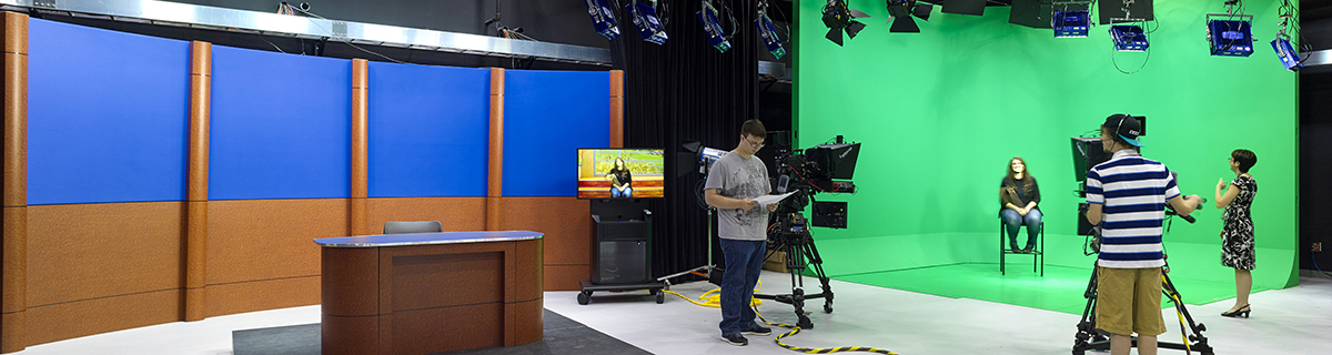 filming studio with green screen and news desk
