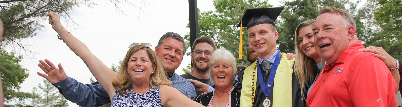 family celebrates their graduate