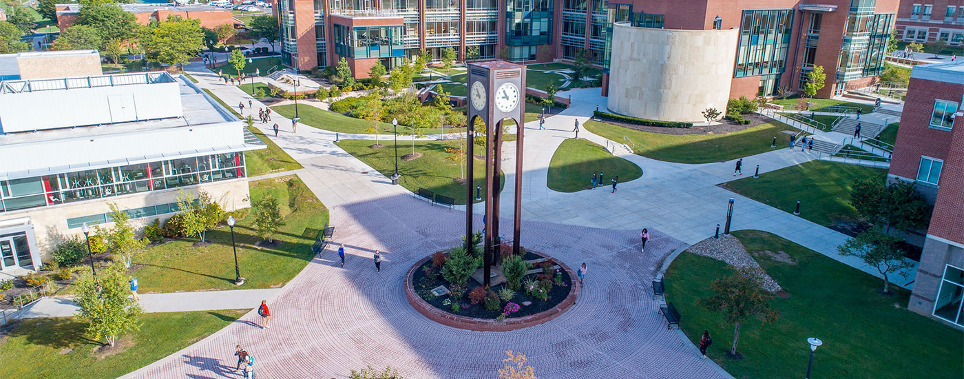 Frostburg State students walk to and from class by the clocktower in the middle of campus