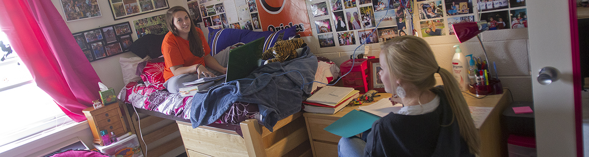 Student in residence hall room