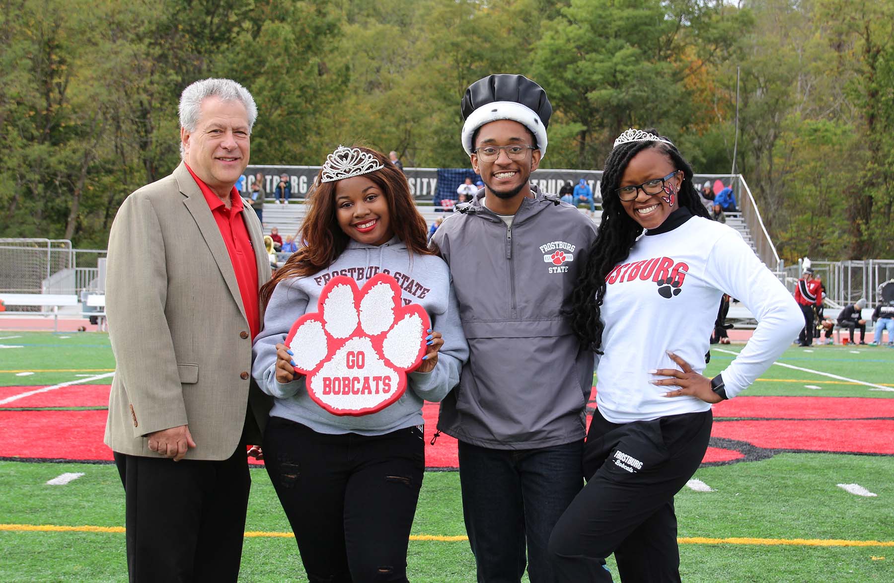 President Nowaczyk with homecoming queen, king, princess