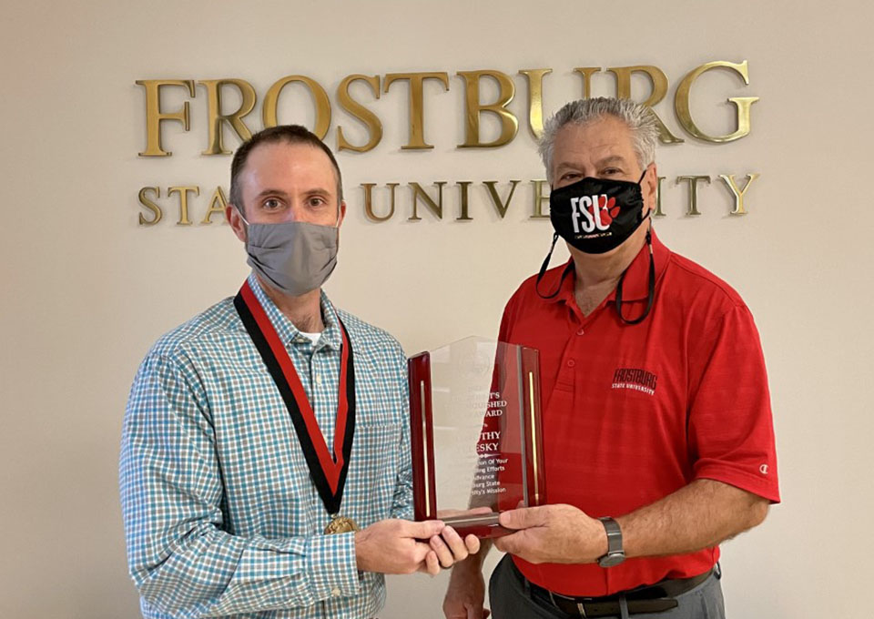 Tim Pelesky receives Distinguished Staff Award