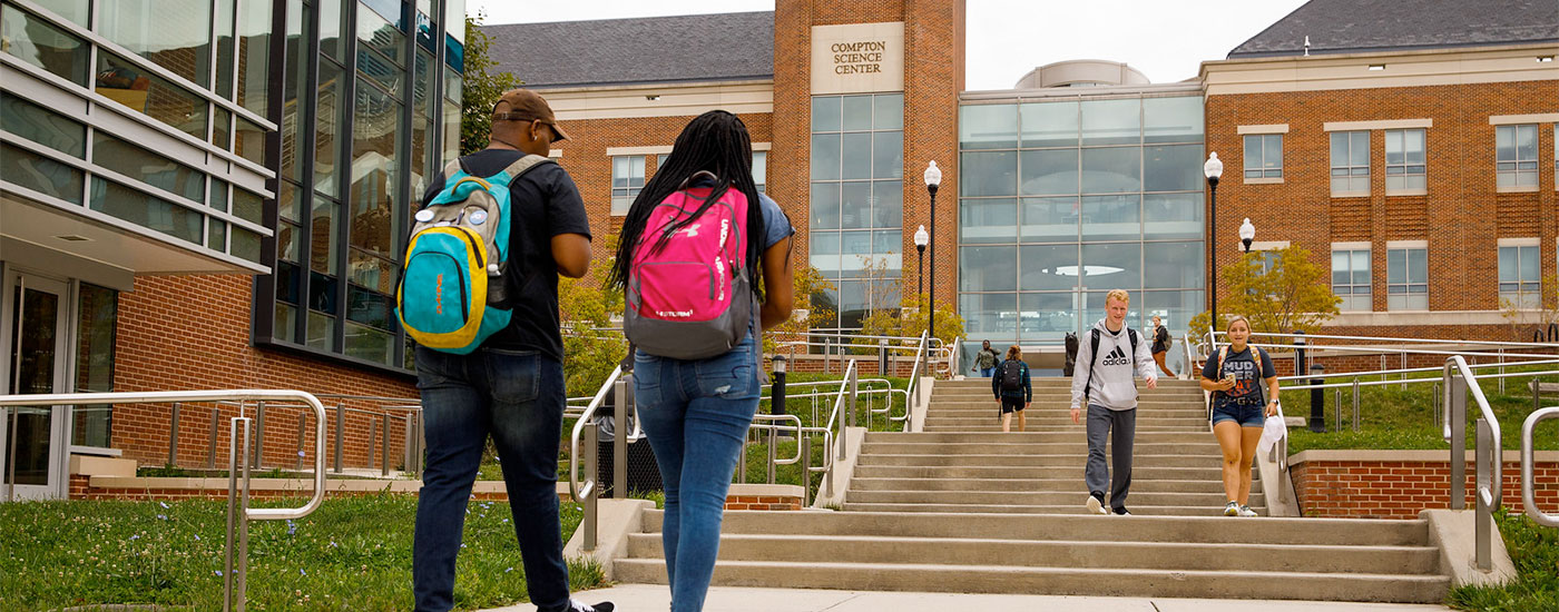 Students walk to and from class outside of the Compton Science Center