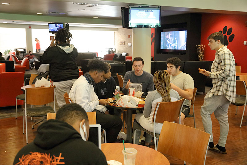 Students eat in the Lane Center