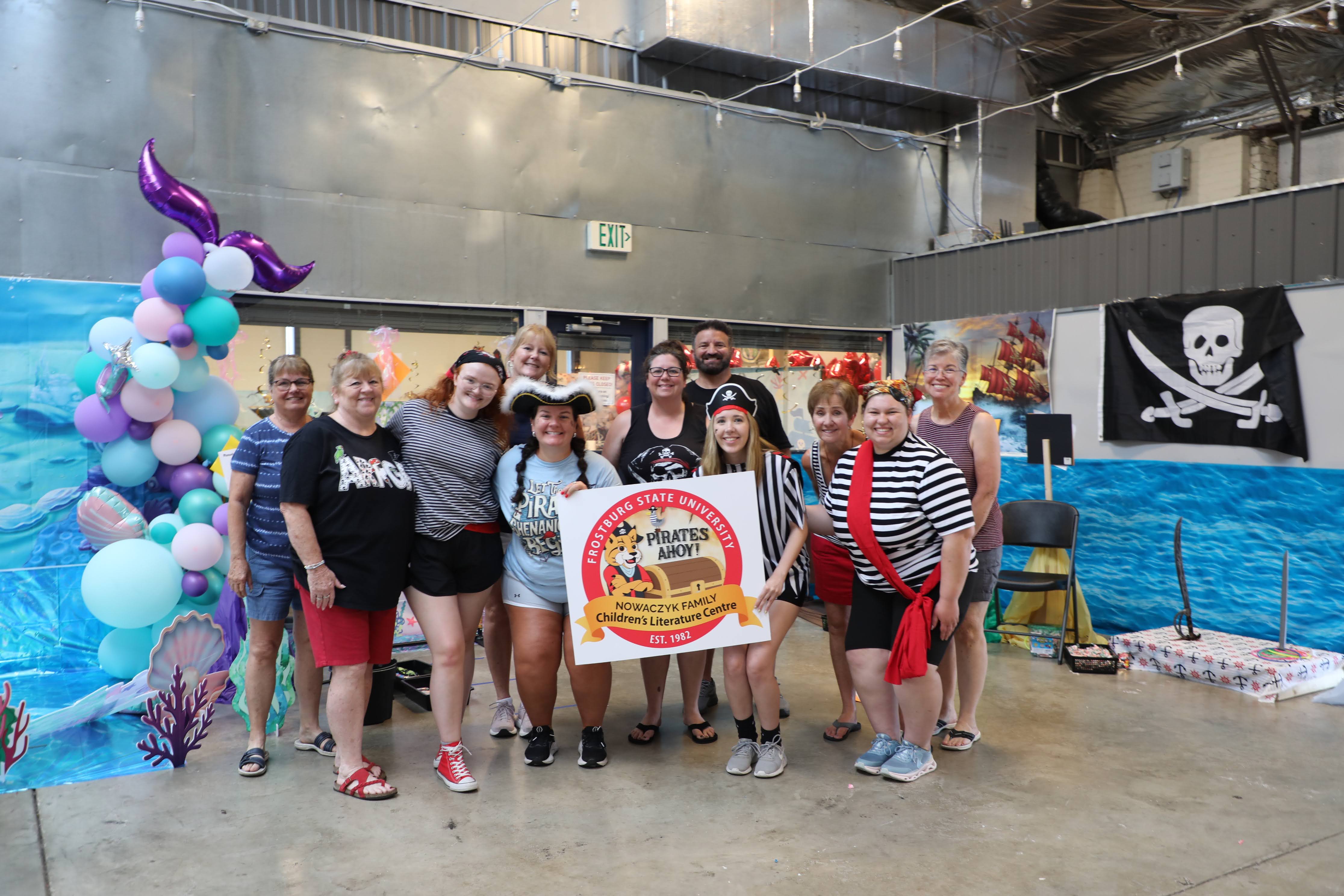 CLC Team Members dressed in pirate attire posing for a group picture