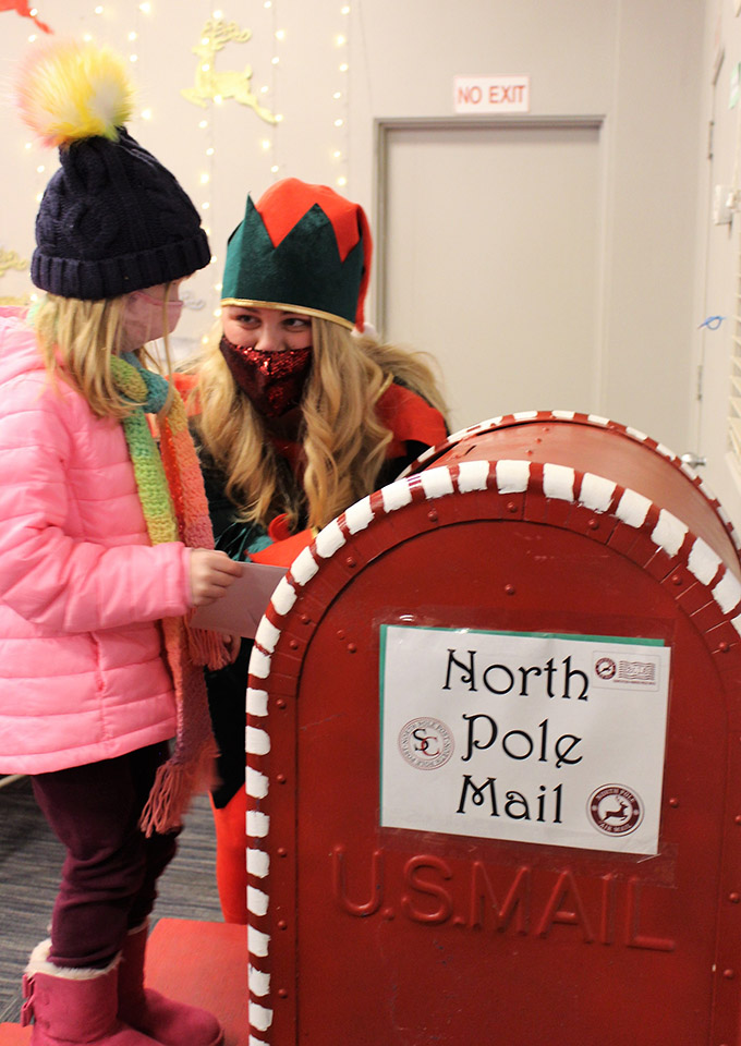 Child Mailing Letter to Santa