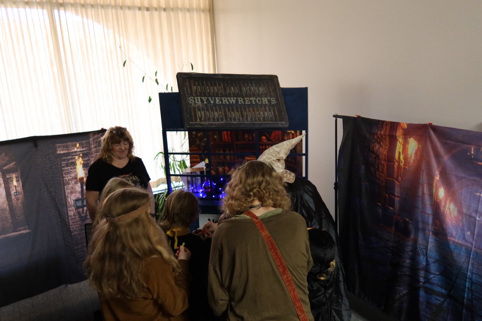Children surrounding Chamber of Secret door casting spells
