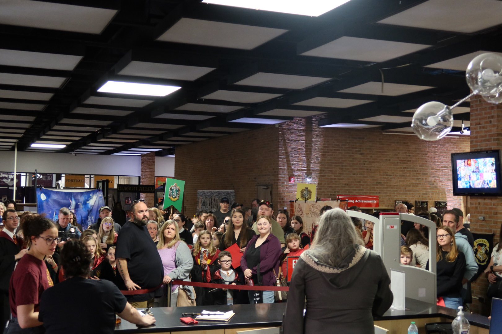 Dumbledore talking to students of Hogwarts, directing to classes.