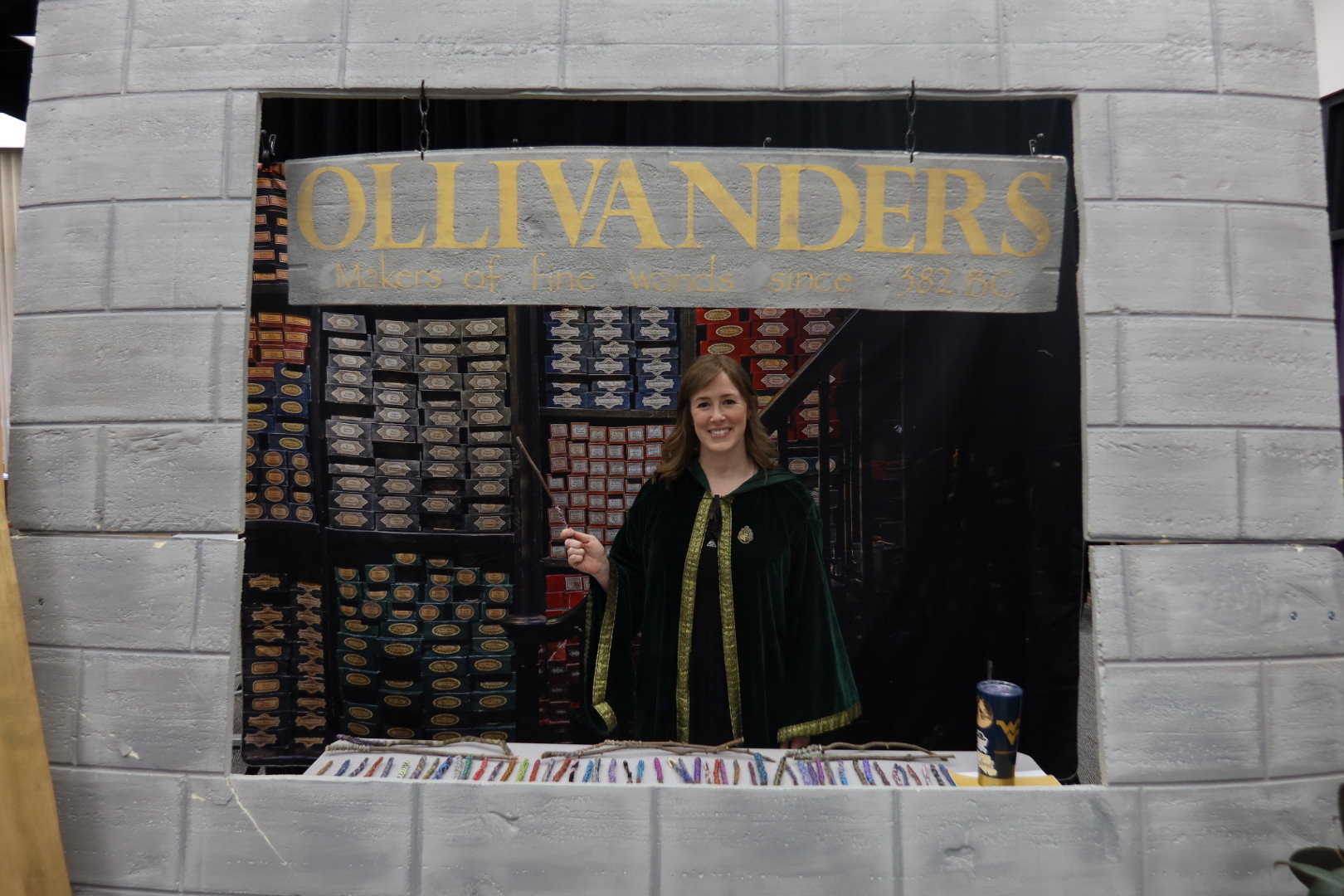 Wizard handing out wands at Olivanders Wand Shop