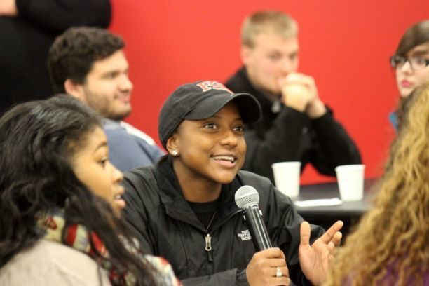 Student speaking at a town hall meeting