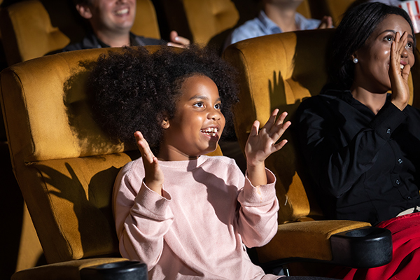 Front Row Center Performance 4 - Young girl sittng in front row of theatre