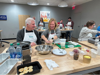 Community members participate in community dinners.