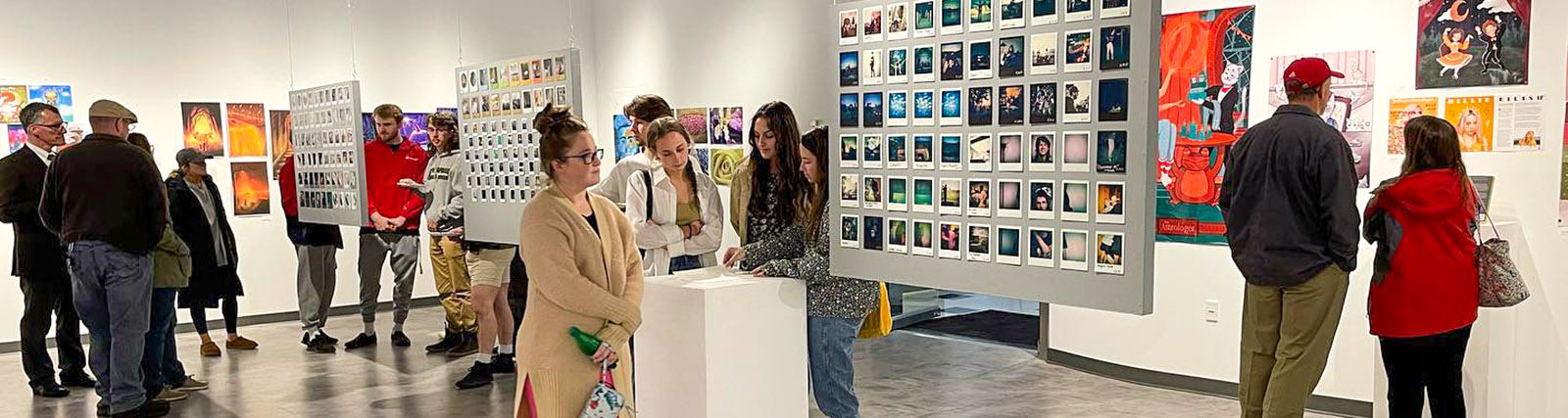 art enthusiasts attend senior art exhibit