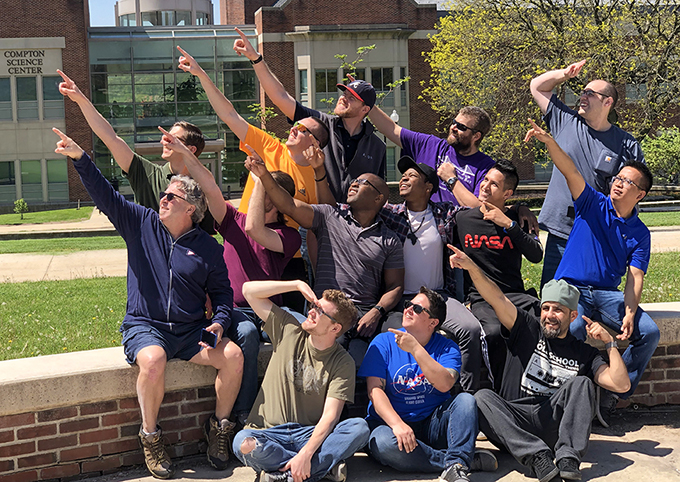 project group points to the sky