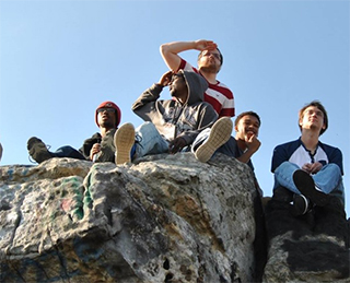Student relax on Dan's Rock on Dan's Mountian in Maryland