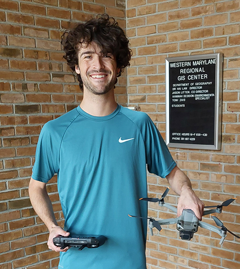 student with drone equipment