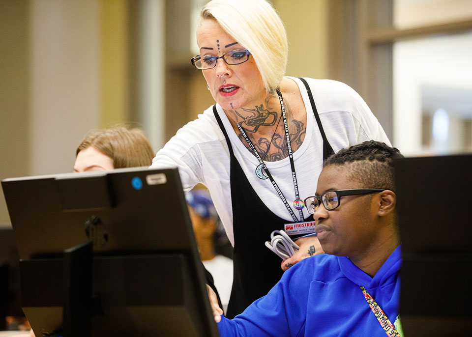 female faculty assists student