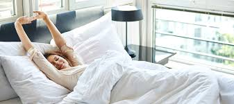 woman in bed waking up