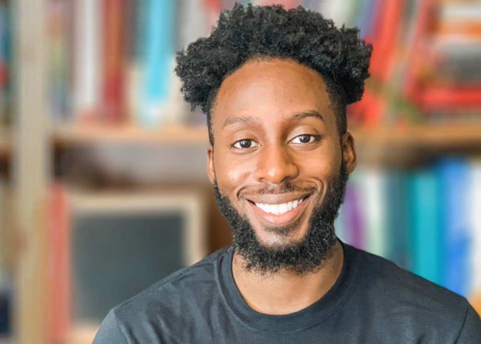 Jermaine Johnson profile in front of books