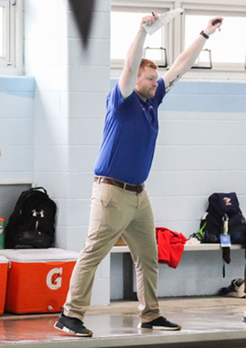 Matthew Brinton cheers for athletes