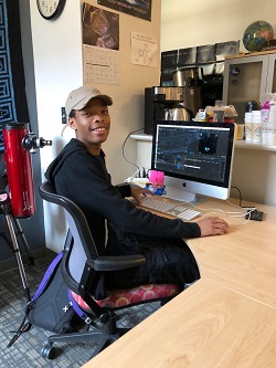 Production Assistant, and federal work study student, Daijourn Marcelle working on a full dome movie