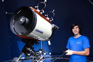 Observatory Assistant Tyler Ram operating the 14" Schmidt Cassegrain telescope