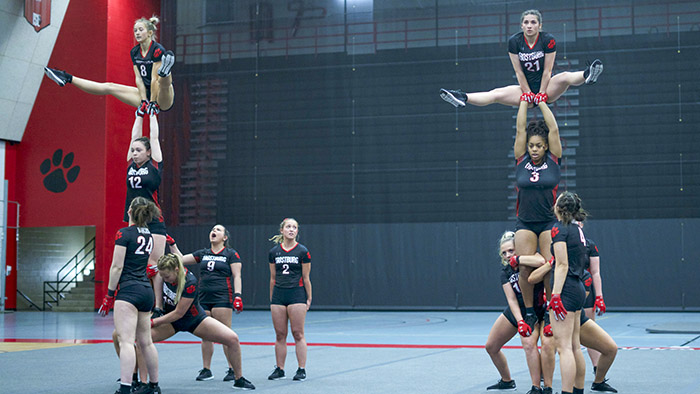 acro tumbling teams build a human pyramid