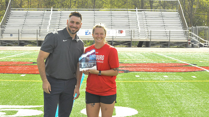 WLAX coach recieve trophy
