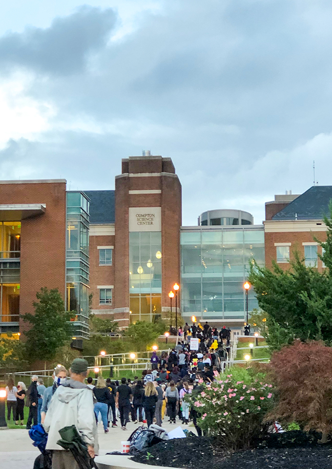 vigil on FSU campus, crowd climbs the steps from clocktower to Compton Science Center