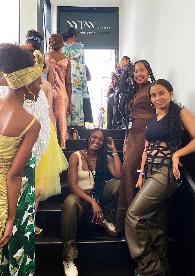 Scholastique Koolimo (center) backstage at New York Fashion Week.