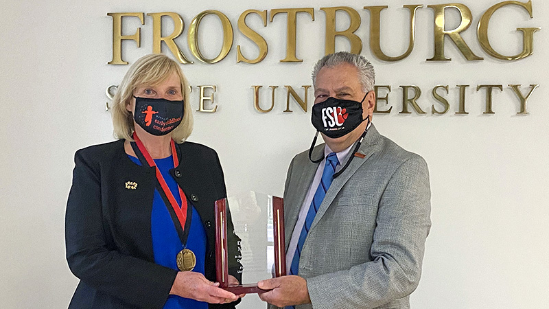 Mattern and President Nowaczyk pose with award