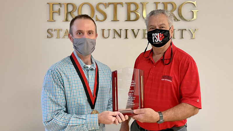 Pelesky and Nowaczyk pose with award
