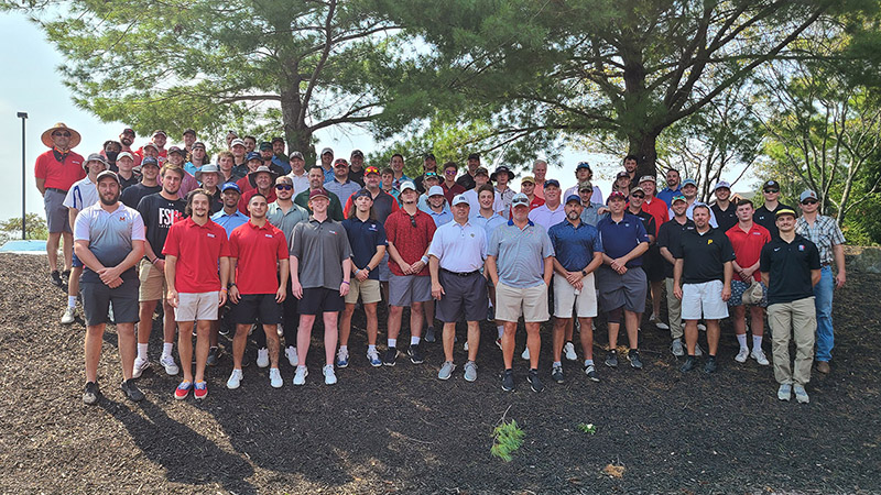 lacrosse alum ni group photo outdoors