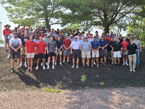 groups of mens lacrosse alumni posing for photo