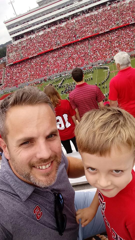 Dr. Barett and his son at a football game