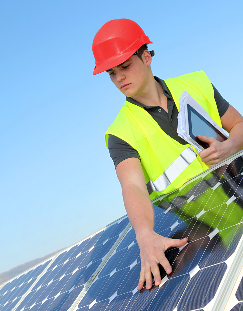 intern working on a solar panel array